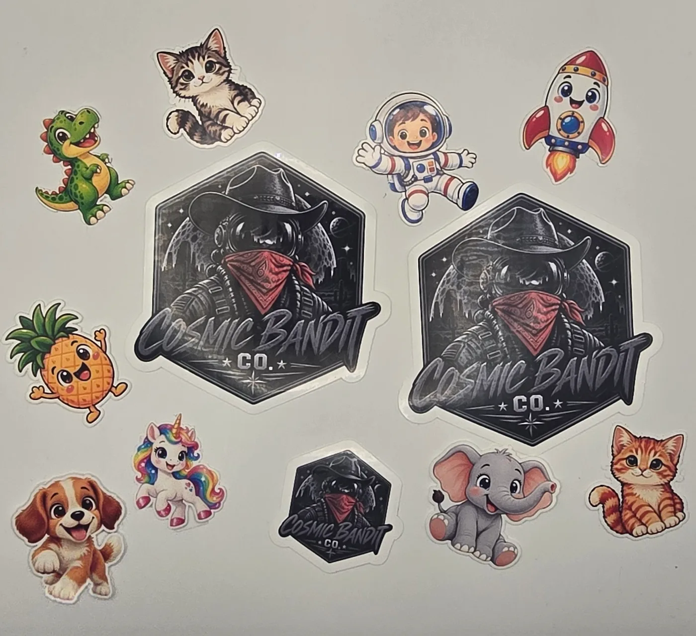 A collection of custom Cosmic Bandit stickers cut around the shape of each design